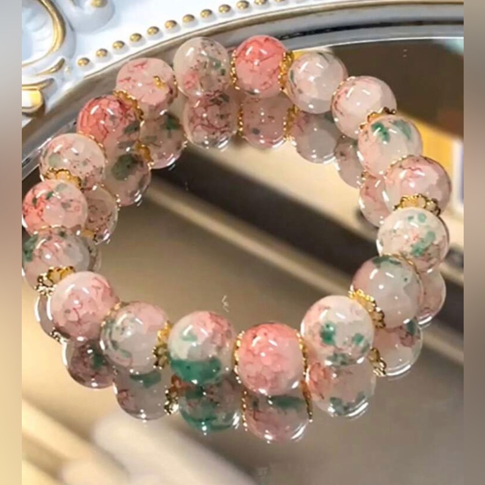 Beautiful floral peach pink toned beaded bracelet